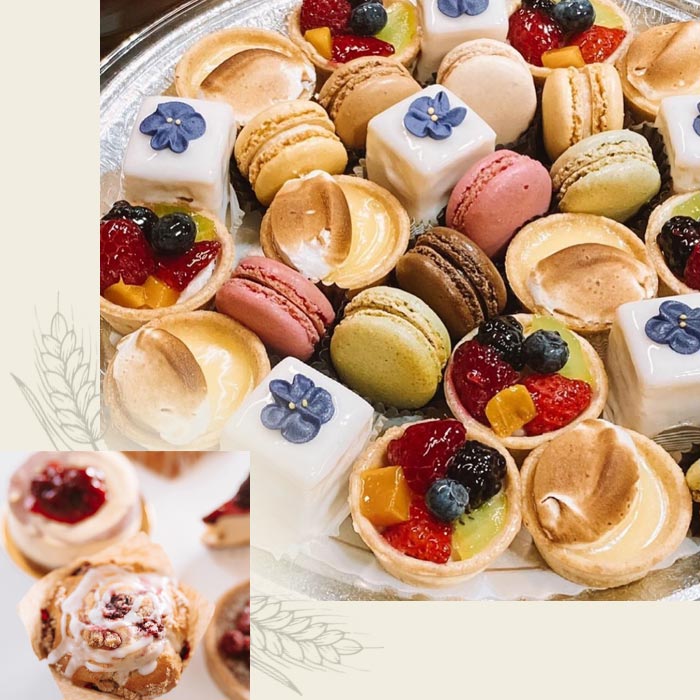 Assorted macarons, fruit tarts, meringue, and petits fours, perfect for café or catering platters.